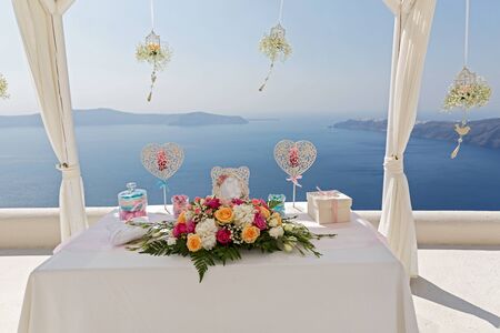 Wedding  bouquets of flowers on the table, against the sea. Greece.の写真素材