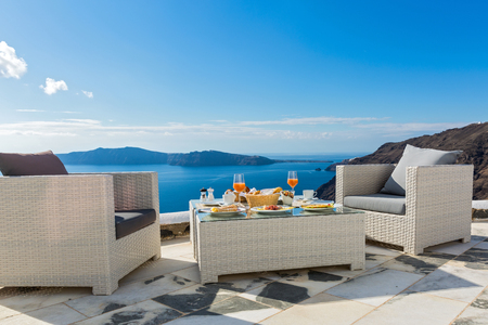 Fresh juice and  Breakfast on the shore of the blue sea, Greece, Santorini.の写真素材