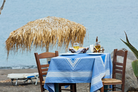 Table for two in the restaurant on the beachの写真素材