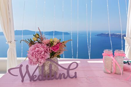 Table for the wedding ceremony on the sea backgroundの写真素材