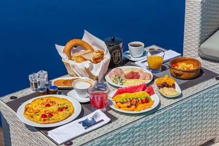 Breakfast on the background of sea and mountainsの写真素材
