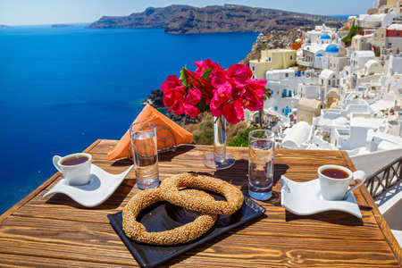 Coffee and scones in the morning on the beach in Greeceの写真素材