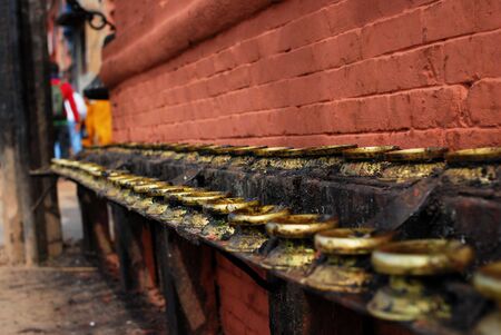 Oil lamp holder beside the brickwallの写真素材