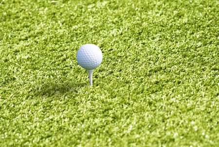 Golf ball on the green grassの写真素材