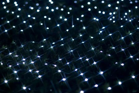 Defocused blue light effect against black backgroundの写真素材