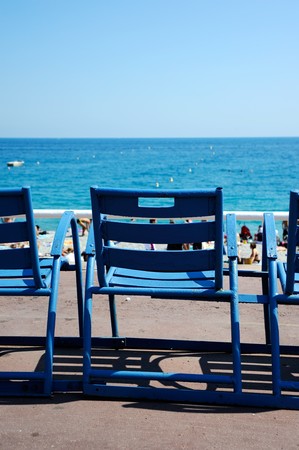 Closeup of chairs beside the seaの写真素材