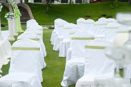 Row of decorated chairs on a outdoor wedding の写真素材