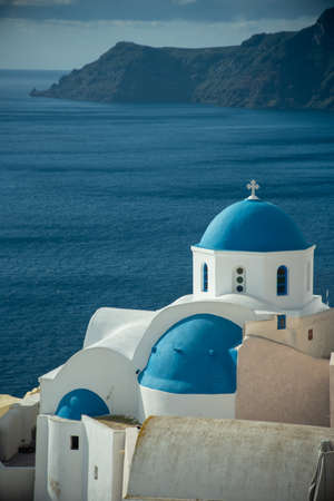 Blue dome church in Oia village, Santorini island, Greece.の写真素材