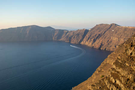Santorini caldera view from the top of the hill. Blue sky and water.の写真素材