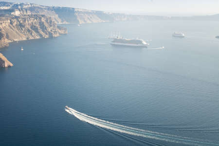 Santorini caldera view from the top of the hill. Blue sky and water.の写真素材