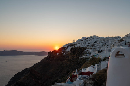 The view of Imerovigli village at sunset, sun setting down...の写真素材