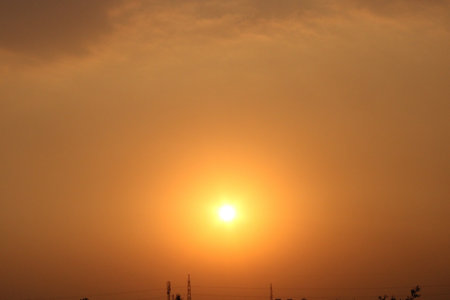 Beautiful sunset in the orange sky. The sun goes down.の写真素材