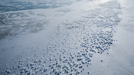 Frozen river with ice crystalsの写真素材