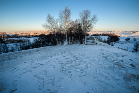 Inner Mongolia Chifeng City, Hexigten Banner China Ulan Buh winter grassland sceneryの写真素材