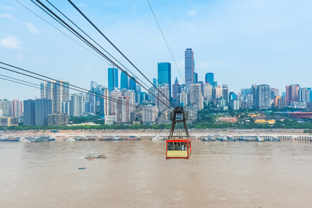Cable car traveling above the riverの写真素材