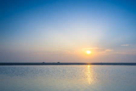 China's sea beach with sunrise sceneryの写真素材