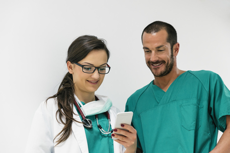 Doctor and nurse using mobile.の写真素材