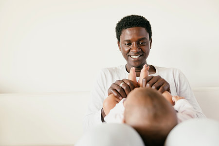 Happy Father and baby Have Fun in Home.の写真素材