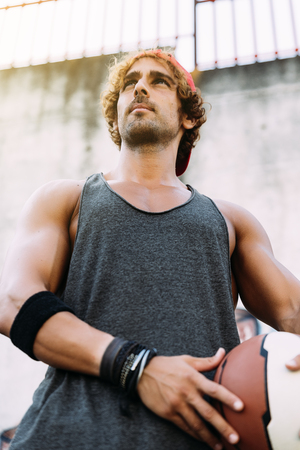 Portrait of Handsome Man with Casual Sport wear and basket ball.の写真素材