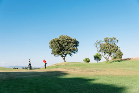 Golfer and Caddie playing golf. Golf Concept.の写真素材