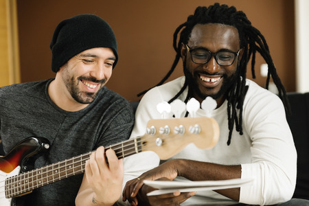 Artists producing music in their home sound studio.の写真素材