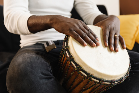 Musician Playing Drum with his hands.の写真素材