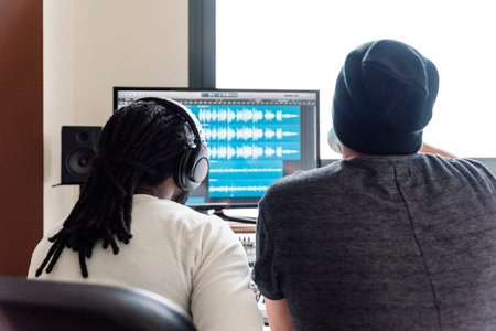 Artists producing music in their home sound studio.の写真素材