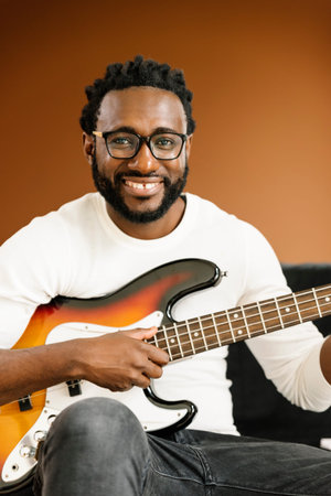 Artist producing music in his home sound studio.
