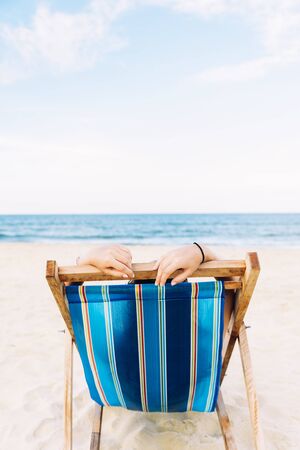 Woman Relaxing On The Beach. Vacation Summer Concept.の写真素材
