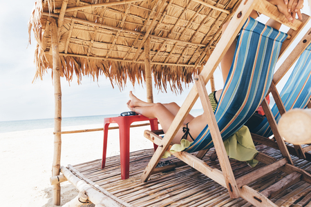 Woman Relaxing On The Beach. Vacation Summer Concept.の写真素材