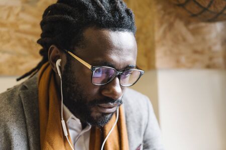 Businessman using his laptop in the Coffee Shop. Business Concept.の写真素材