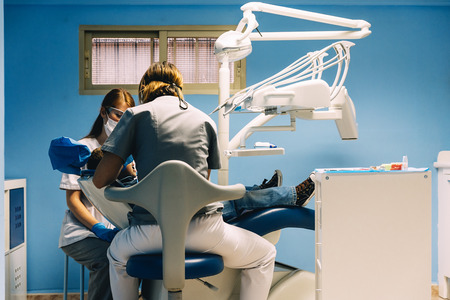Dentists with a patient during a dental intervention to boy. Dentist  Conceptの写真素材