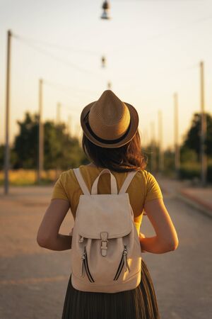 Back view of young woman looking the road. Overcoming concept.の写真素材