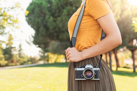 Close up of a photographer with her camera. Photographer concept.
