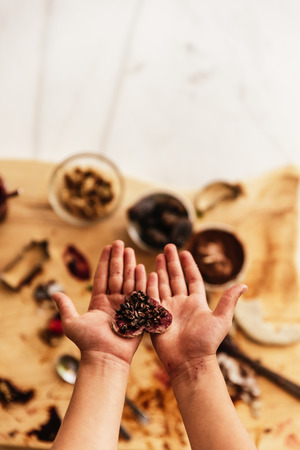 Close up of child hands preparing baking cookies. Infant Chef Concept.の写真素材