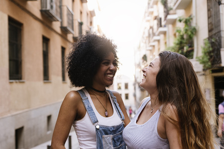 Beautiful women having fun in the street. Youth concept.の写真素材