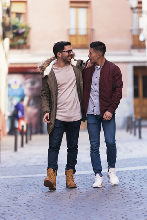 Two friends having fun in the city.の写真素材