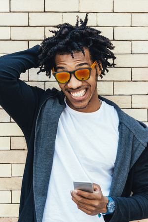 Portrait of handsome afro man in the street.の写真素材
