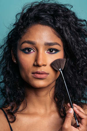 Woman Wearing Make up in Studioの写真素材