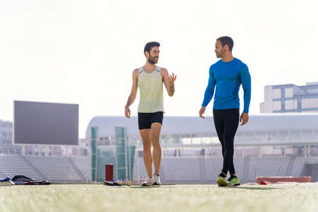 Athletes Talking in Athletic Trackの写真素材