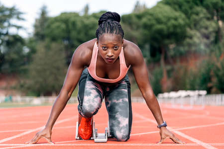 Athlete sprinter in starting positionの写真素材