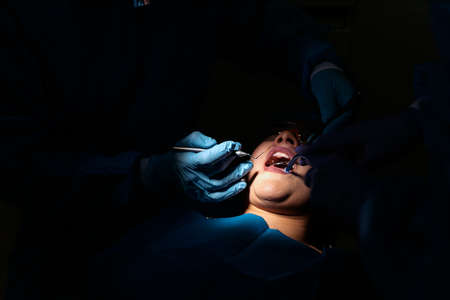 Close up of Patient During Dentist Visitの写真素材