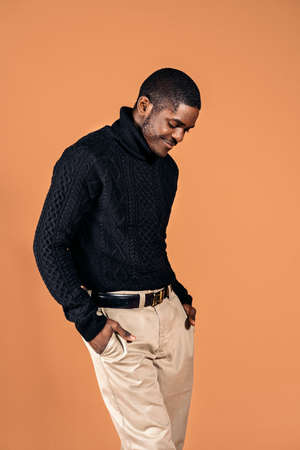 Stock photo of smiley black man smiling and posing in studio shot.の写真素材