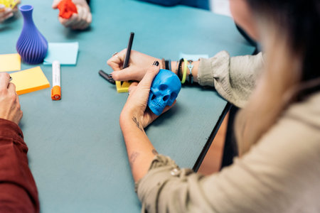 Stock photo of business people during meeting in 3d printing business.