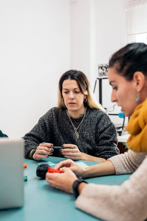 Stock photo of business woman during brainstorming process in 3d printing business.