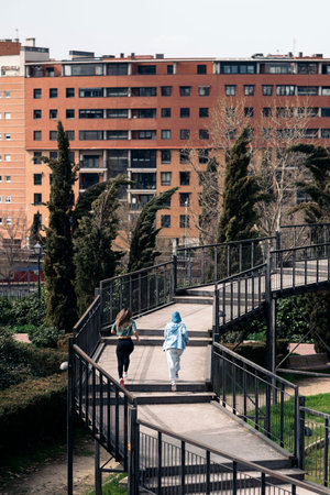 Unrecognized young women wearing sports clothes running in the city and working out.の写真素材