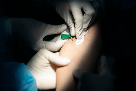 Unrecognized medic worker wearing latex gloves using needle with patient.