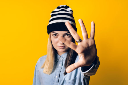 Stock photo of young expressive girl looking at camera in studio.の写真素材