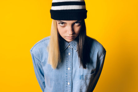 Stock photo of young expressive girl looking at camera in studio.の写真素材