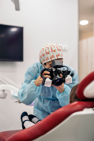 Stock photo of unrecognized clinic worker taking a picture to a patient.の写真素材